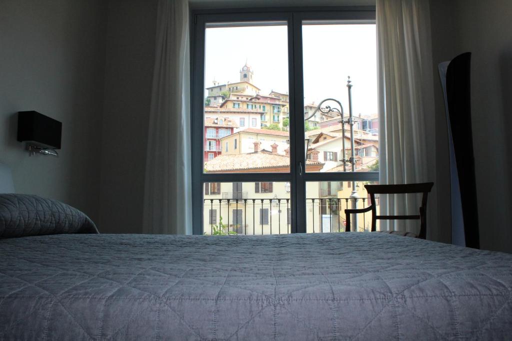 Postel nebo postele na pokoji v ubytování Hotel Il Grappolo D'Oro
