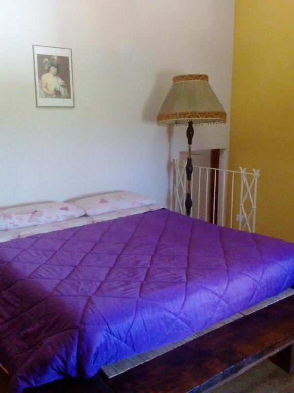 Łóżko lub łóżka w pokoju w obiekcie Antico Casale dei Sogni agriturismo