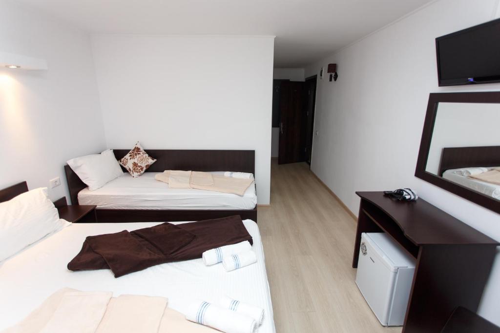 Postel nebo postele na pokoji v ubytování Vila Sandra