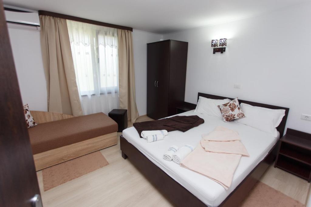 Postel nebo postele na pokoji v ubytování Vila Sandra