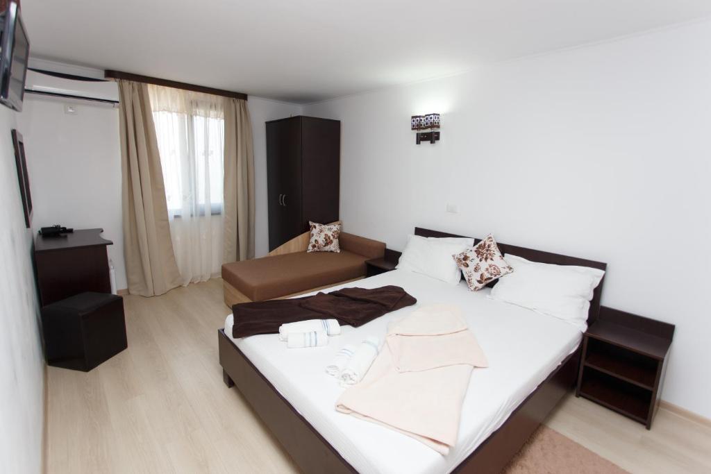 Postel nebo postele na pokoji v ubytování Vila Sandra