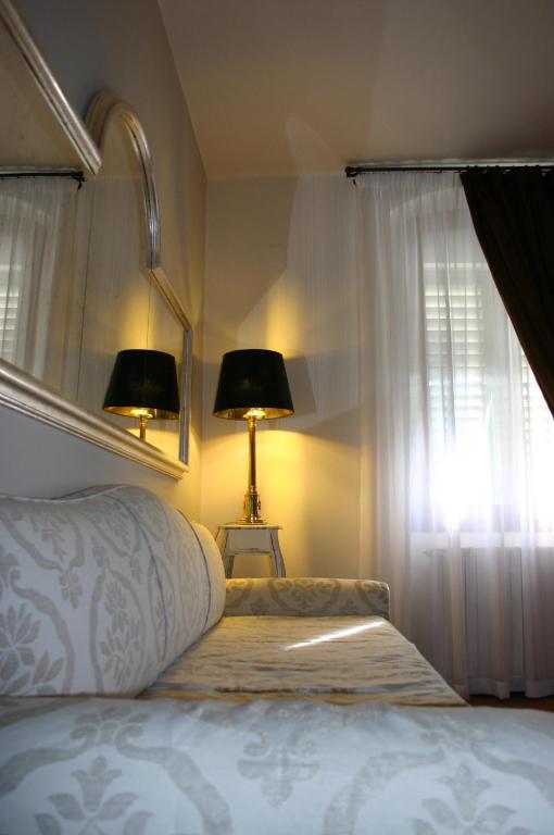 Postel nebo postele na pokoji v ubytování I Parigi Corbinelli Residenze