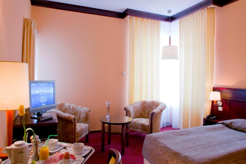 Postel nebo postele na pokoji v ubytování Meduza Hotel & Spa