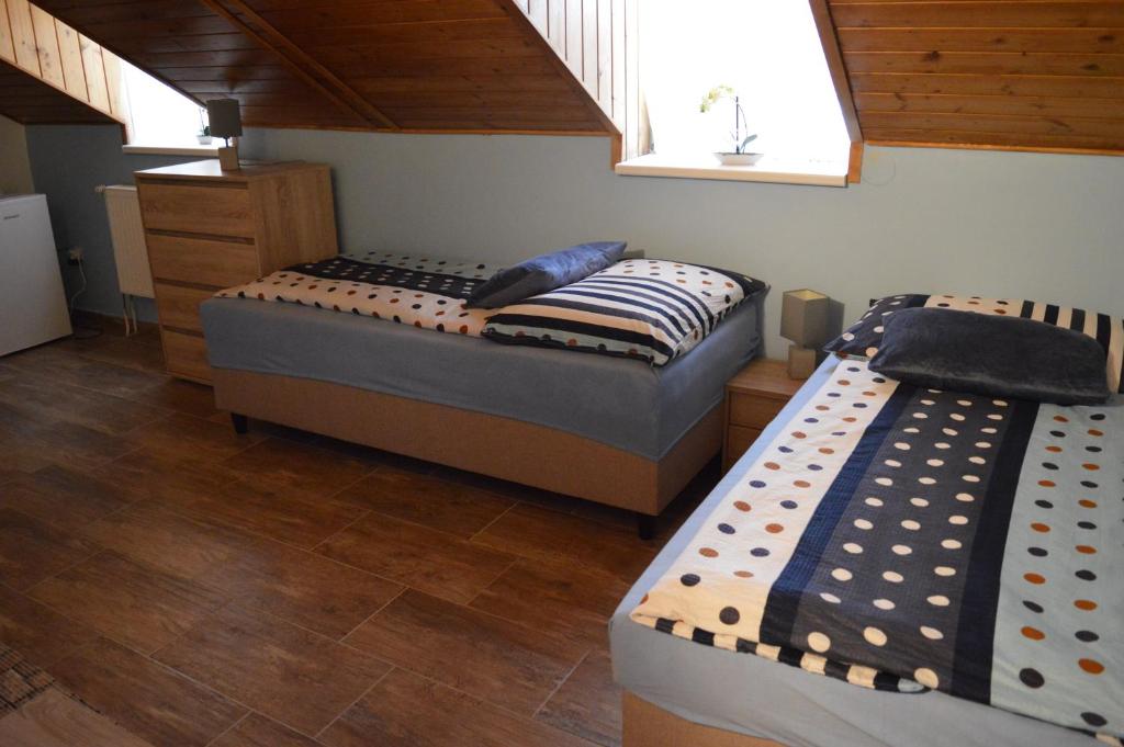 Postel nebo postele na pokoji v ubytování Guest House Haklův Mlýn