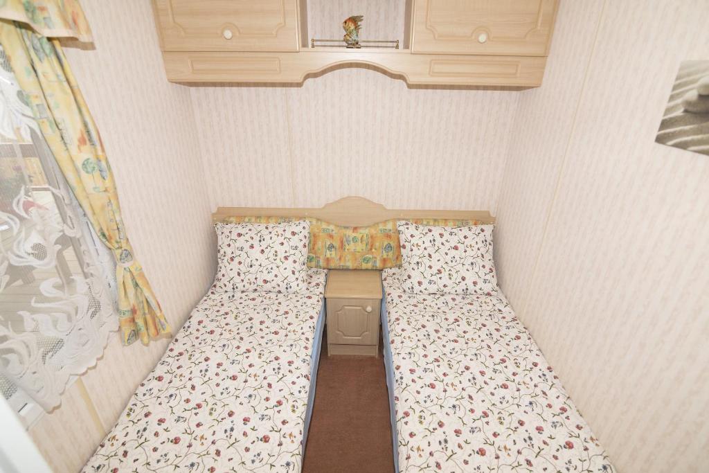 Postel nebo postele na pokoji v ubytování Domki Delux w Helu