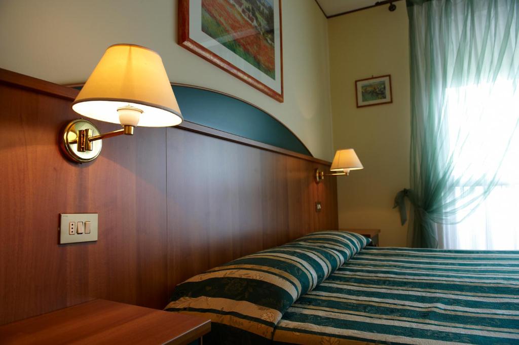 A bed or beds in a room at Agriturismo il Cascinale