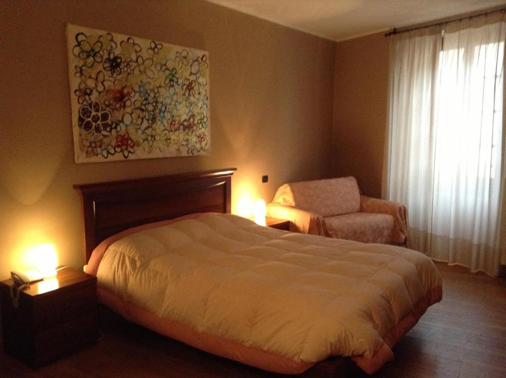 Postel nebo postele na pokoji v ubytování Albergo San Lorenzo