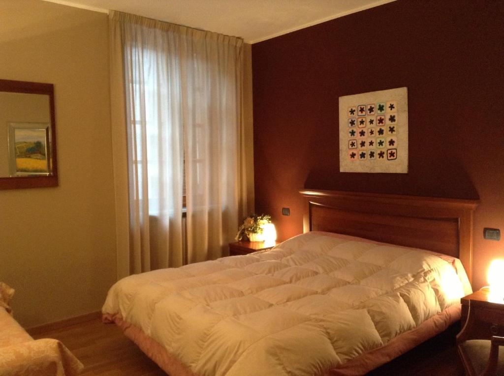 Postel nebo postele na pokoji v ubytování Albergo San Lorenzo