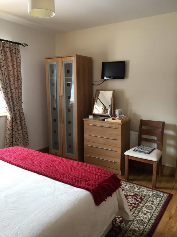 Postel nebo postele na pokoji v ubytování Lissadell Lodge