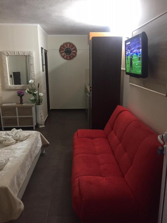 TV a/nebo společenská místnost v ubytování Hotel Alexandros II