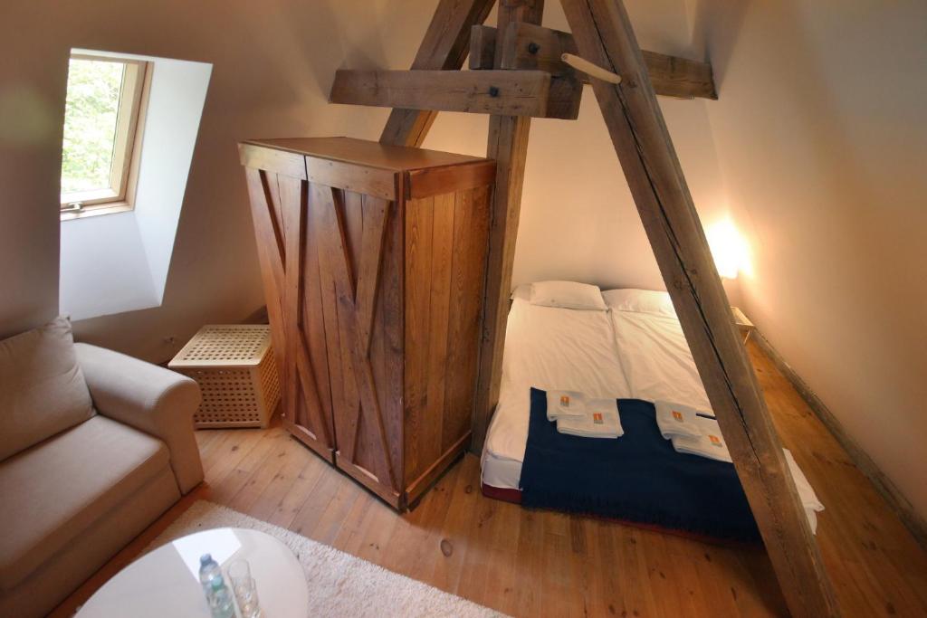 Postel nebo postele na pokoji v ubytování Zamek Reszel