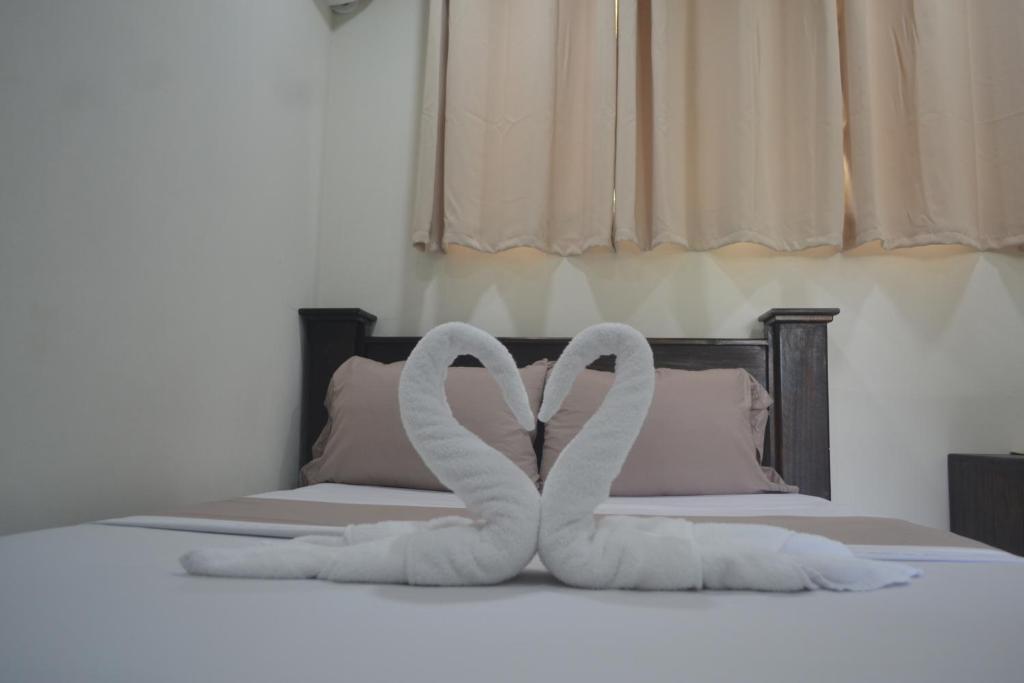 Postel nebo postele na pokoji v ubytování Hotel Don Fito