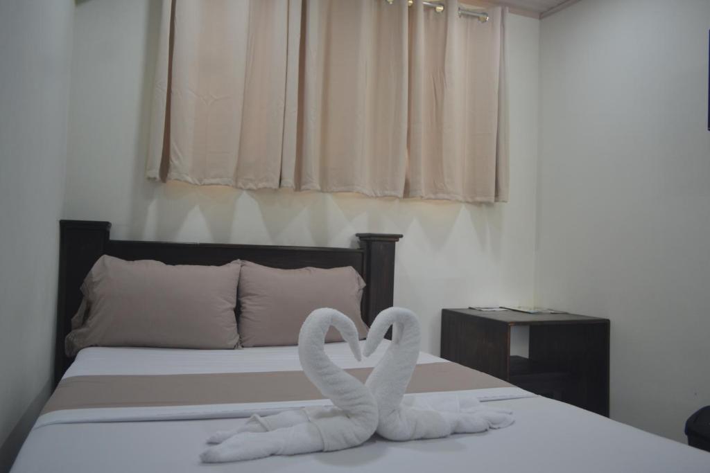 Postel nebo postele na pokoji v ubytování Hotel Don Fito