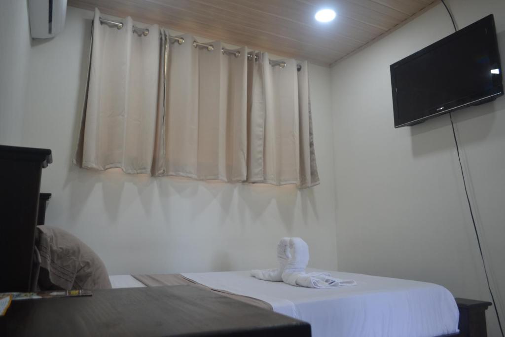 Postel nebo postele na pokoji v ubytování Hotel Don Fito