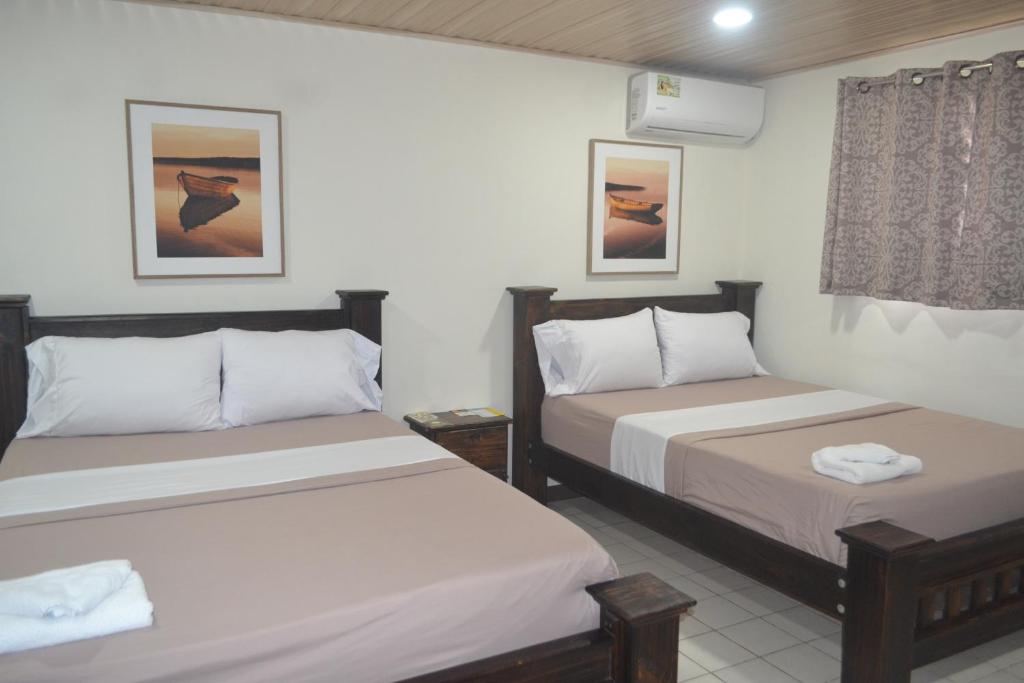 Postel nebo postele na pokoji v ubytování Hotel Don Fito