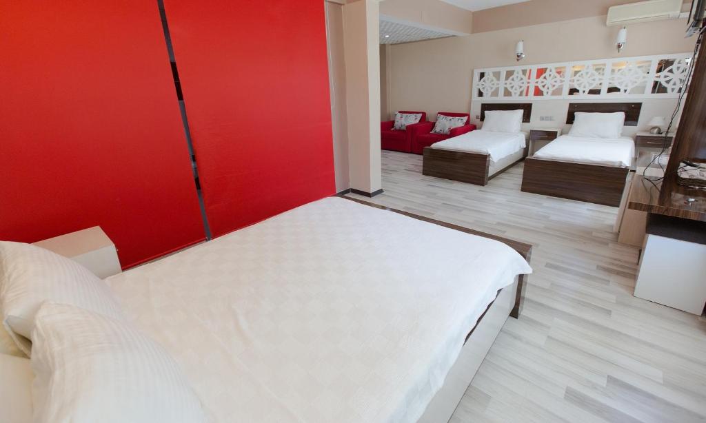 Postel nebo postele na pokoji v ubytování Ozbay Hotel