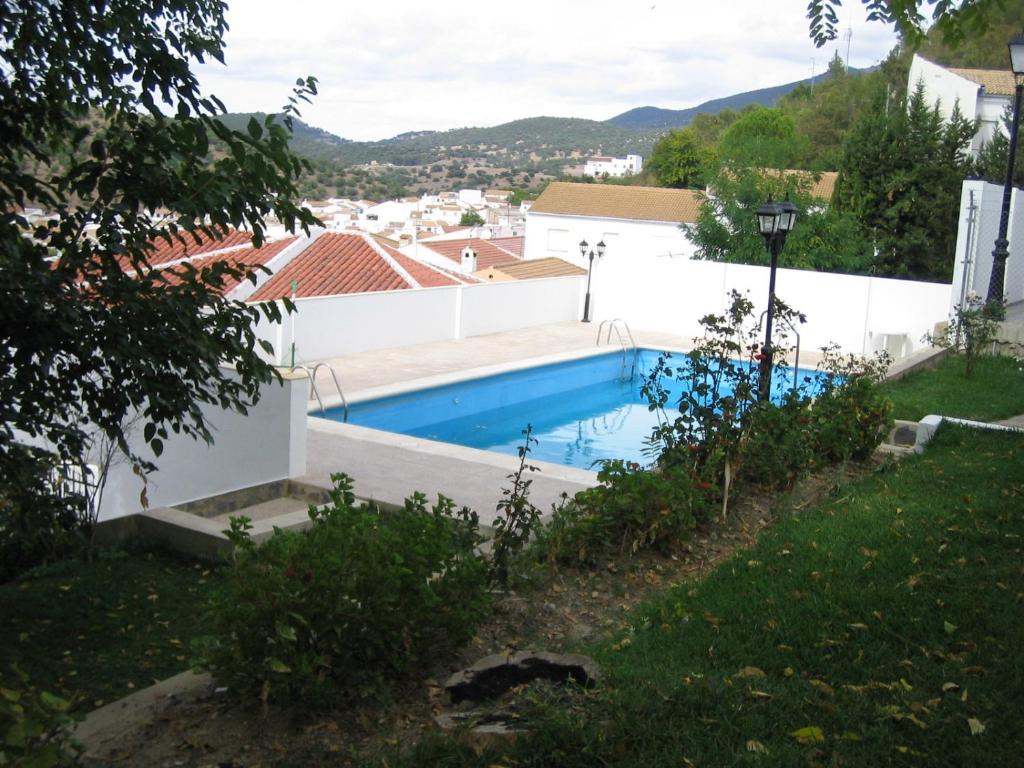 a swimming pool in the backyard of a house at Casas el Albarracín in El Bosque