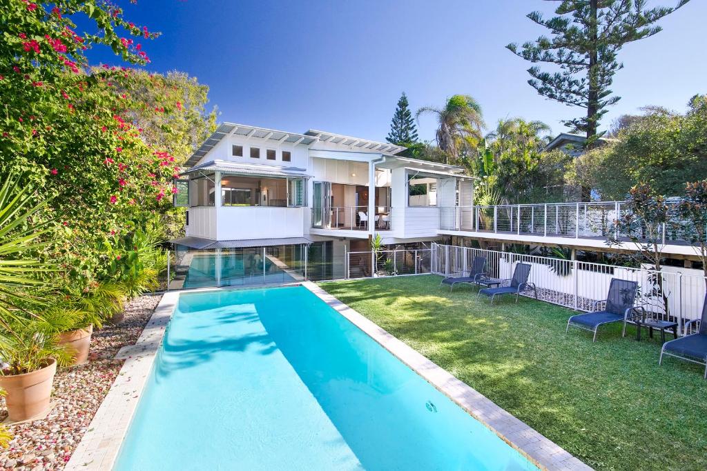 a house with a swimming pool in the yard at 20 Adams Street, Sunshine Beach in Noosa Heads
