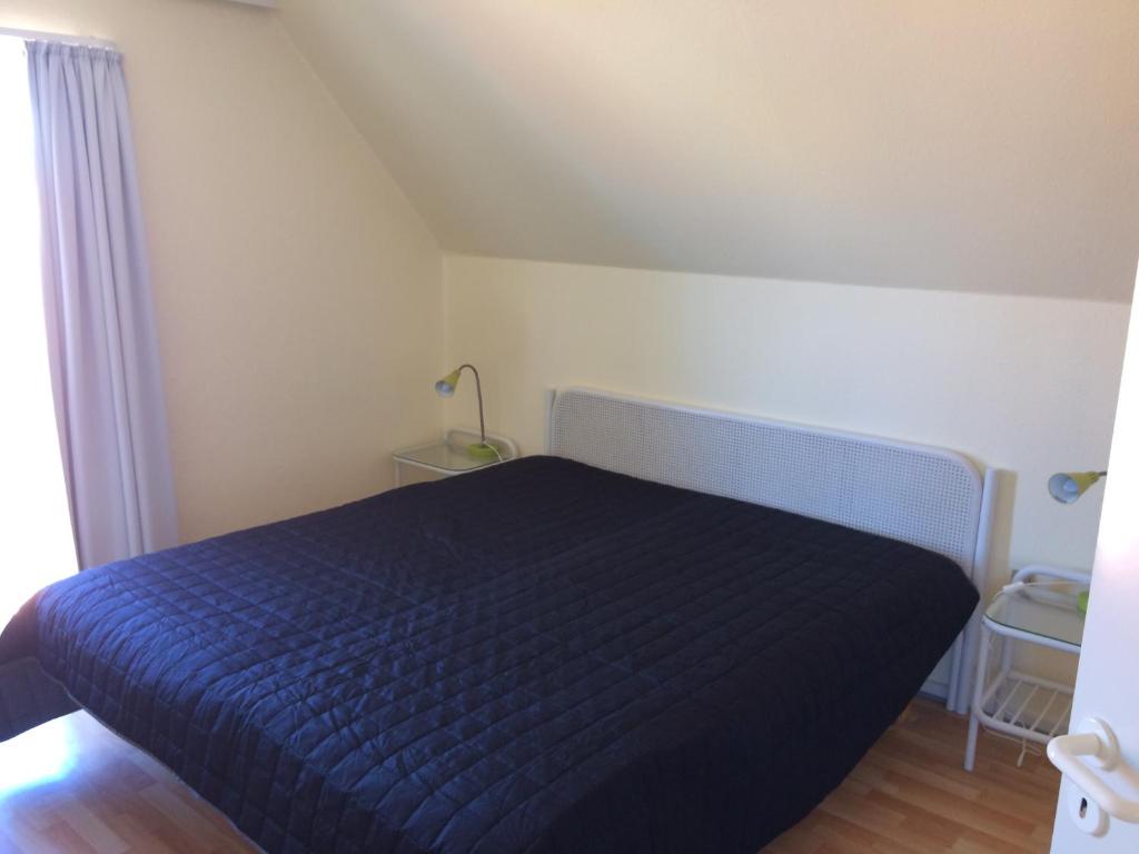 Postel nebo postele na pokoji v ubytování Løkken Badehotel Apartments