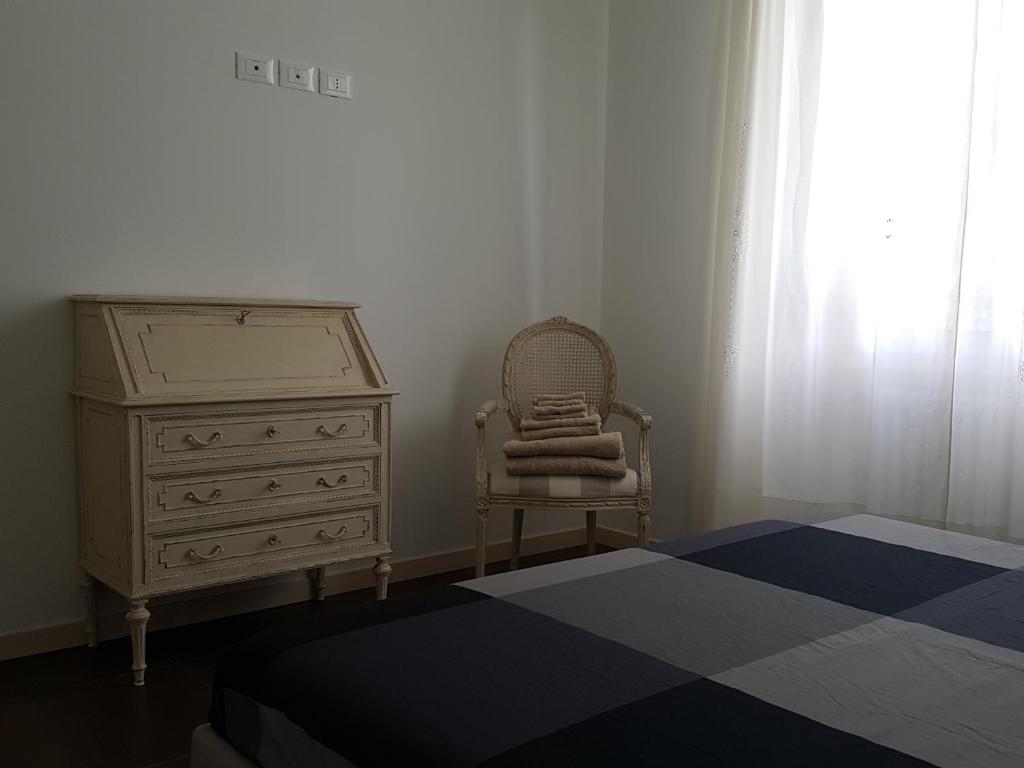 A bed or beds in a room at Casa Savoia