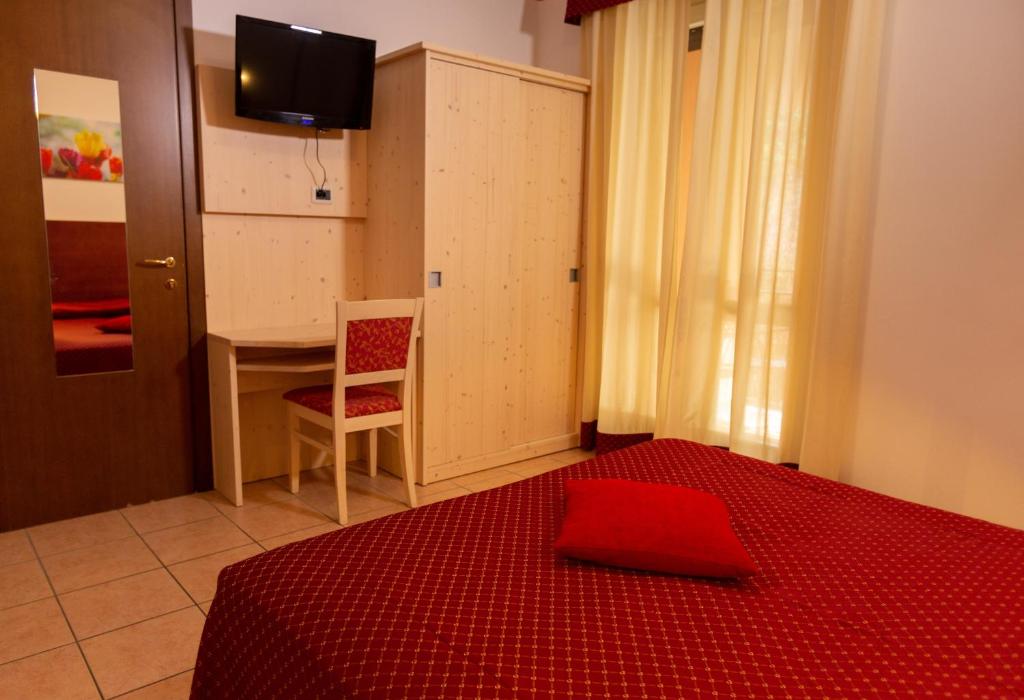 Postel nebo postele na pokoji v ubytování Hotel Residence Sirenella
