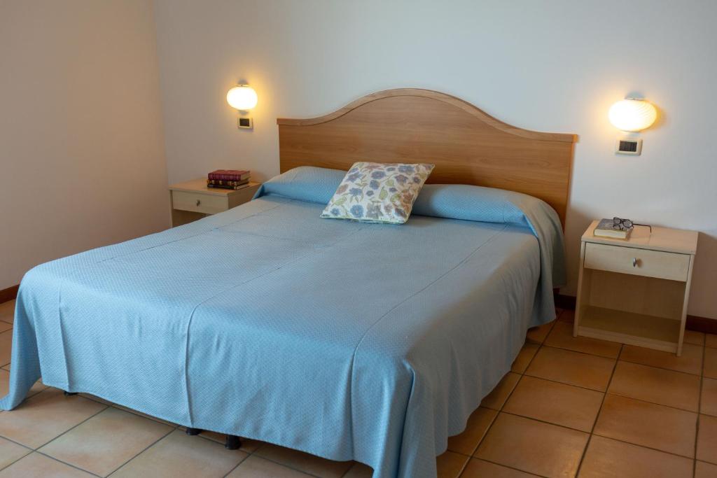Postel nebo postele na pokoji v ubytování Hotel Residence Sirenella