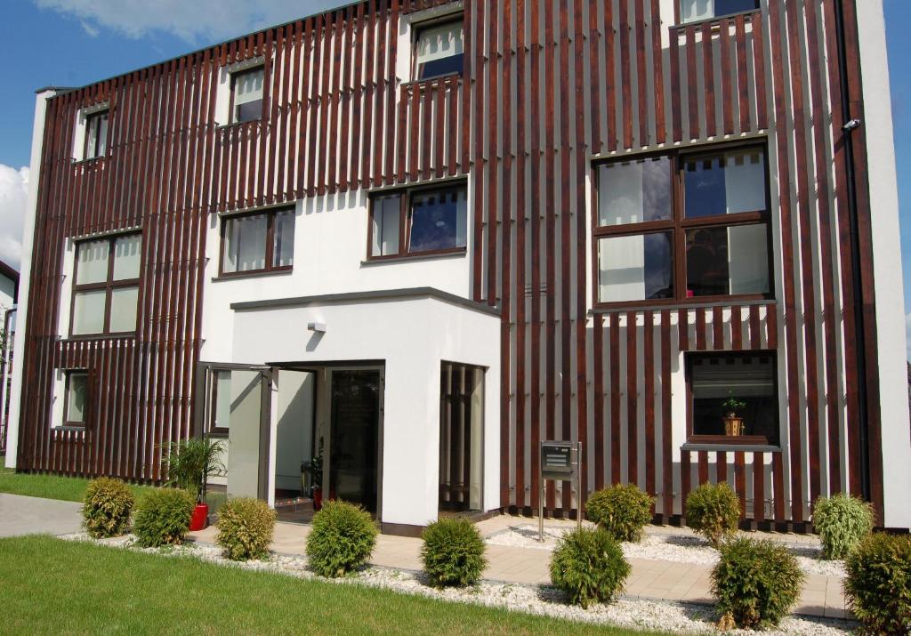 a building with a brown and white facade at Rever in Mielec