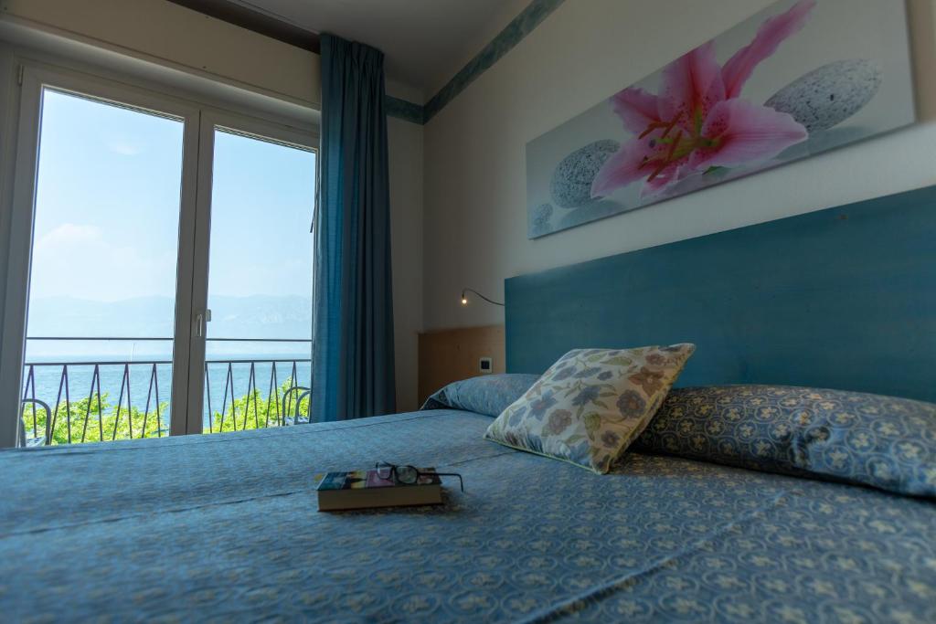 Postel nebo postele na pokoji v ubytování Hotel Residence Sirenella
