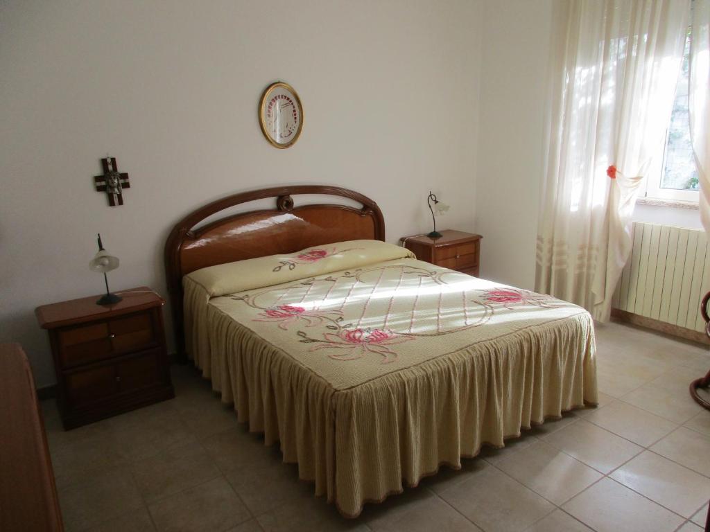 A bed or beds in a room at Casa Dario