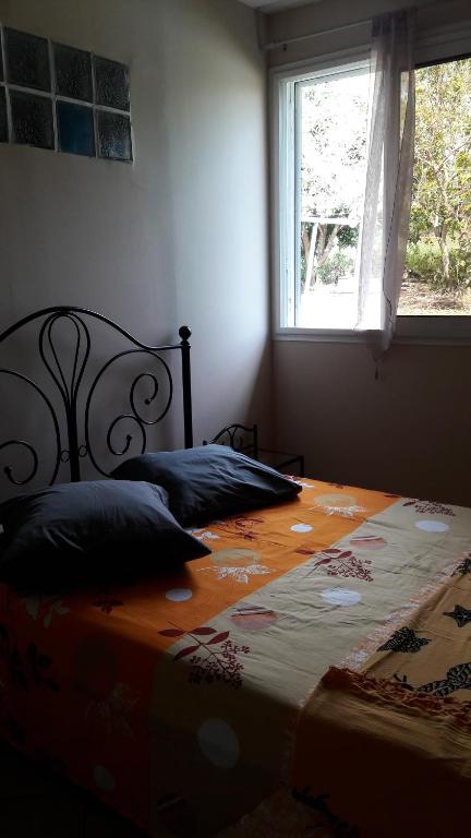 Postel nebo postele na pokoji v ubytování lakazadom974 - Chambres d'Hôtes