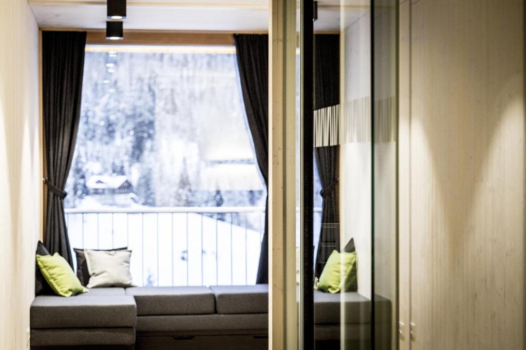 Posezení v ubytování Gradonna Mountain Resort Chalets & Hotel