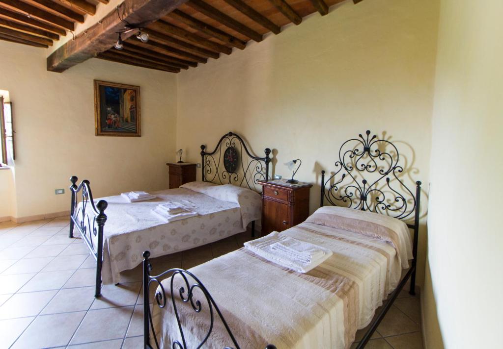 Postel nebo postele na pokoji v ubytování Le Dame del Borgo