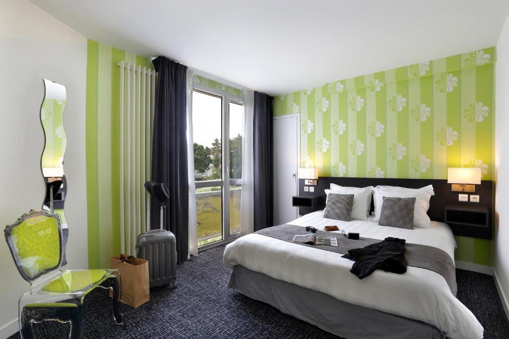 Postel nebo postele na pokoji v ubytování Altos Hotel & Spa