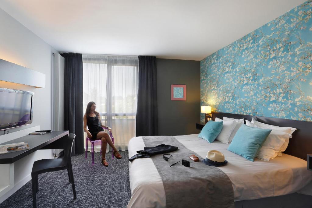 TV a/nebo společenská místnost v ubytování Altos Hotel & Spa