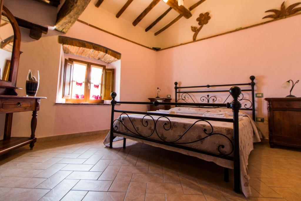 Postel nebo postele na pokoji v ubytování Le Dame del Borgo