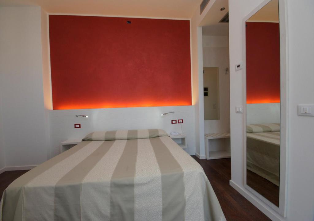 Postel nebo postele na pokoji v ubytování Hotel Aragosta