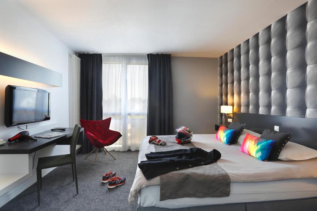 TV a/nebo společenská místnost v ubytování Altos Hotel & Spa