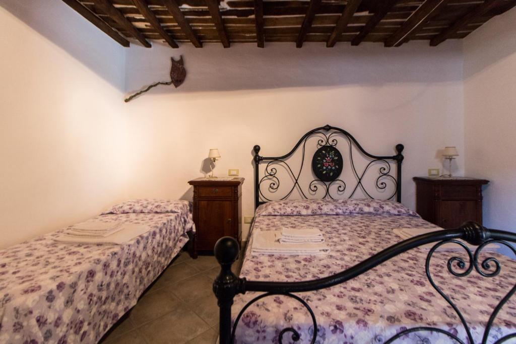 Postel nebo postele na pokoji v ubytování Le Dame del Borgo