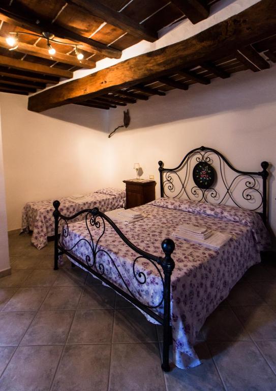 Postel nebo postele na pokoji v ubytování Le Dame del Borgo