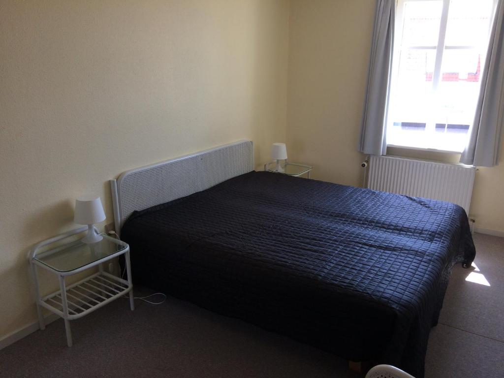 Postel nebo postele na pokoji v ubytování Løkken Badehotel Apartments