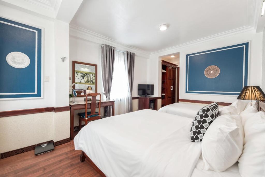Postel nebo postele na pokoji v ubytování Prince II Hotel