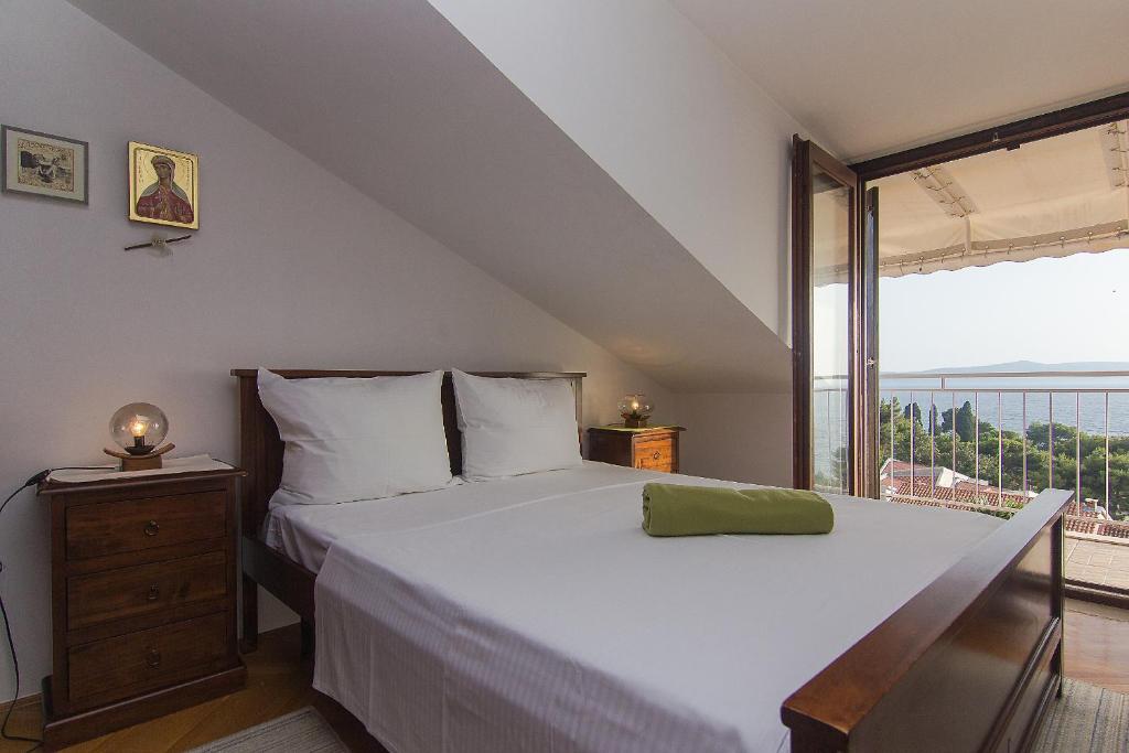 Posteľ alebo postele v izbe v ubytovaní Apartman Podgora