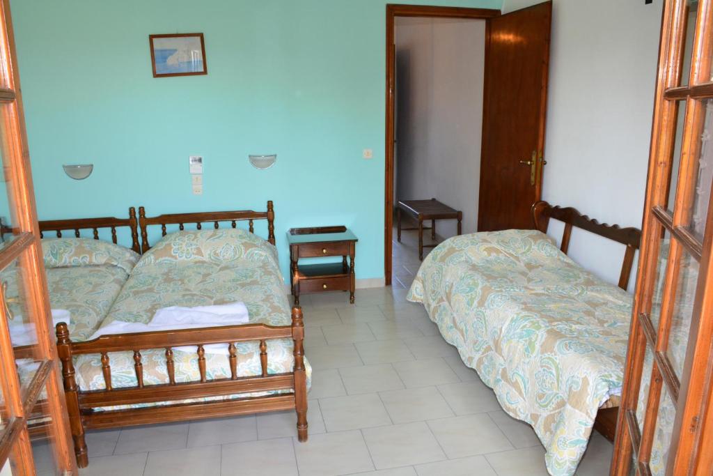Posteľ alebo postele v izbe v ubytovaní Voula Apartments