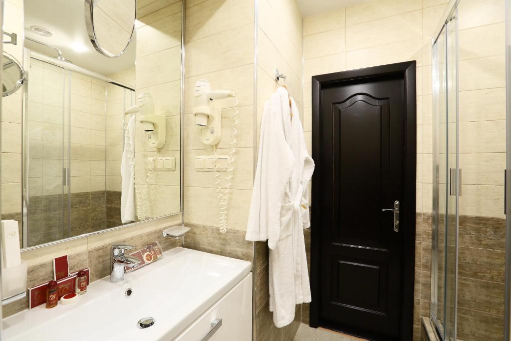 Koupelna v ubytování Oberig Hotel