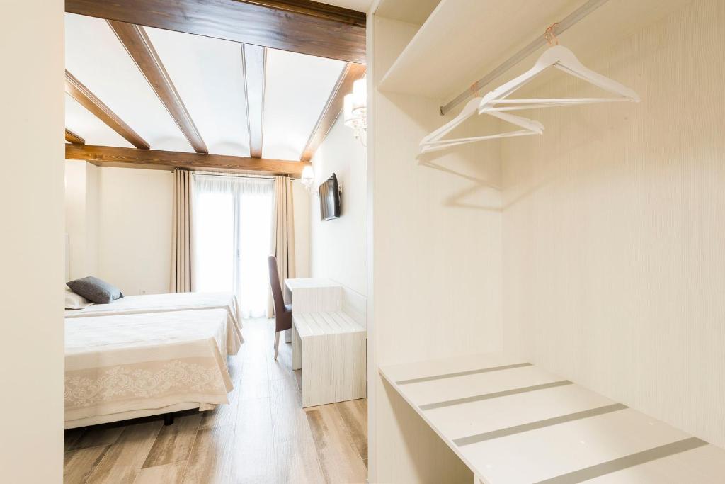 Postel nebo postele na pokoji v ubytování Hotel Atiana