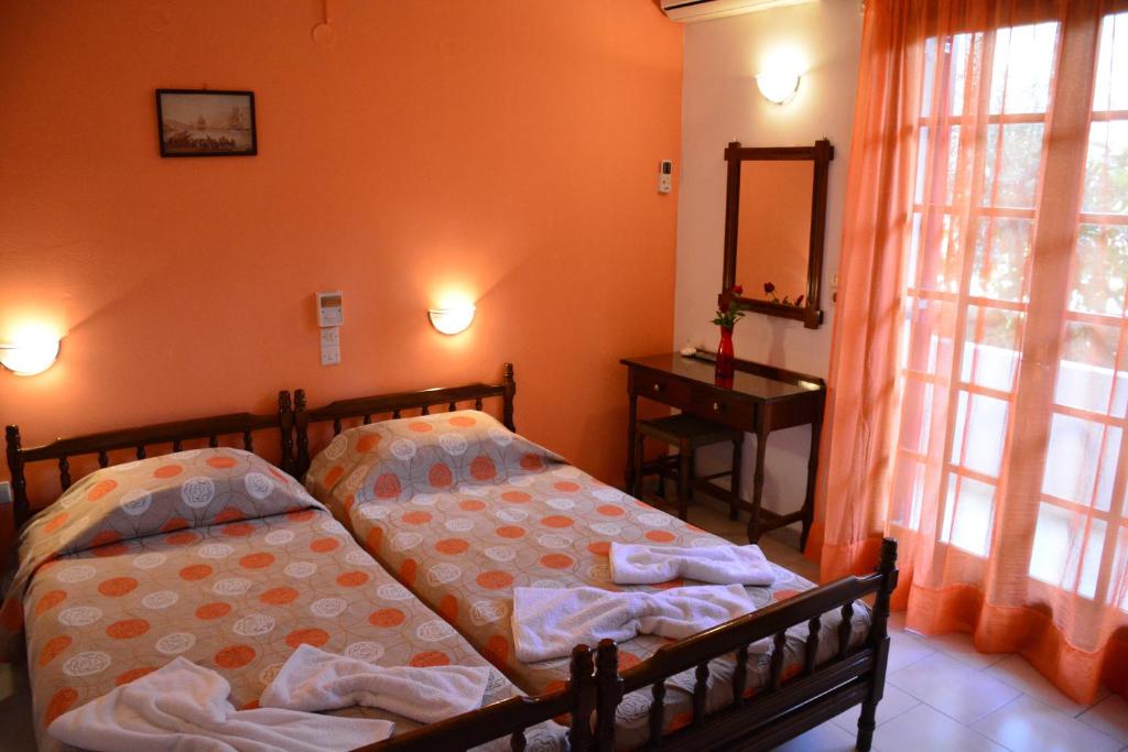 Posteľ alebo postele v izbe v ubytovaní Voula Apartments