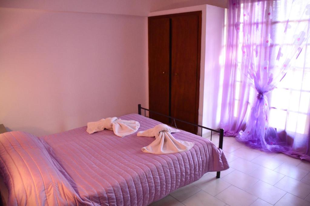 Posteľ alebo postele v izbe v ubytovaní Voula Apartments