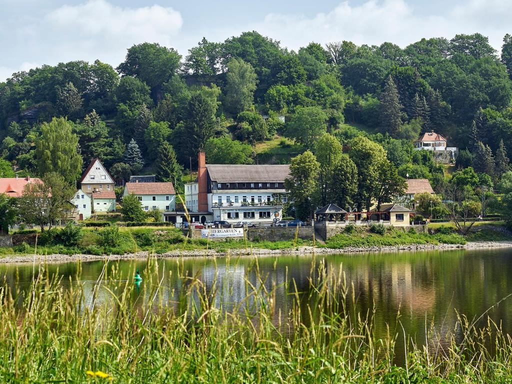 a town on the shore of a body of water at Hotel Elbparadies in Pirna