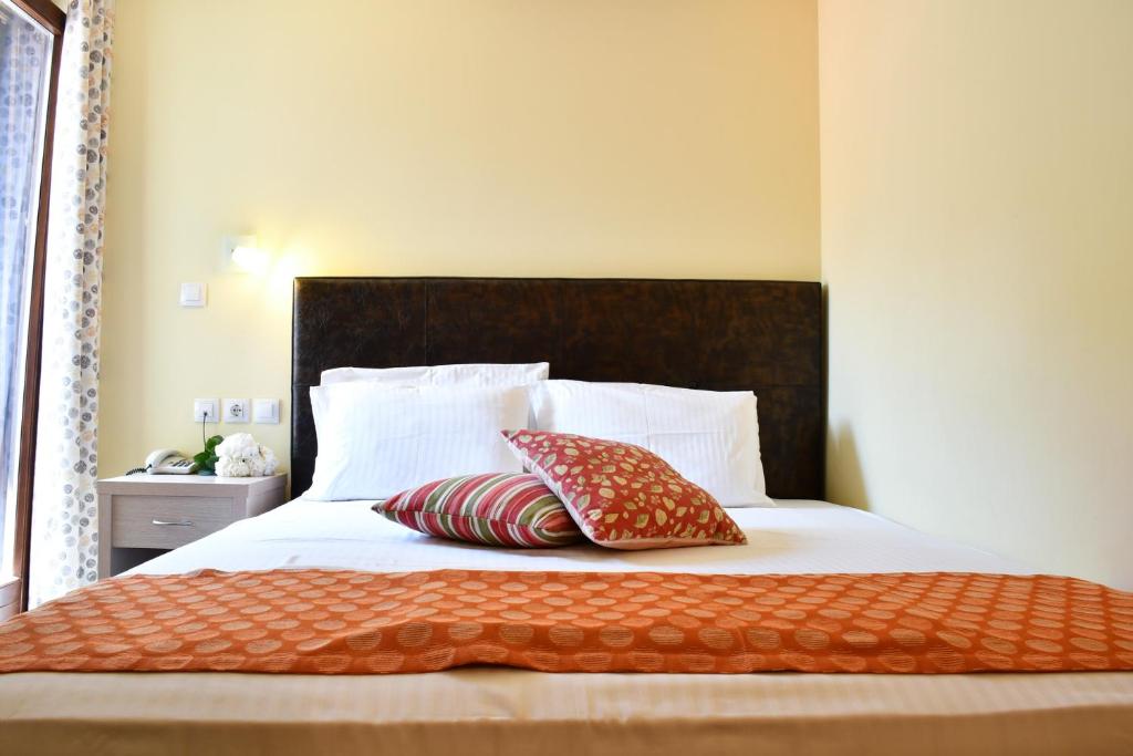 Postel nebo postele na pokoji v ubytování Hotel Manthos Blue