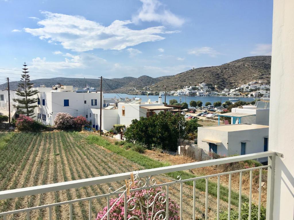 a view of a town from the balcony of a house at Pension Sofia Amorgos-Katapola in Katapola